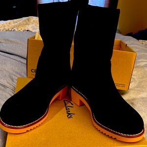 Size 7.5 women’s booties. Black suede. New in box.